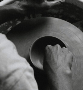 a potter working on a pottery wheel