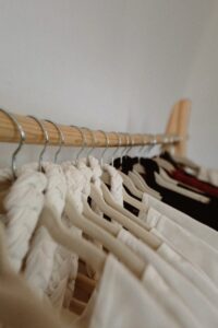Clothing hanging on a wooden rack