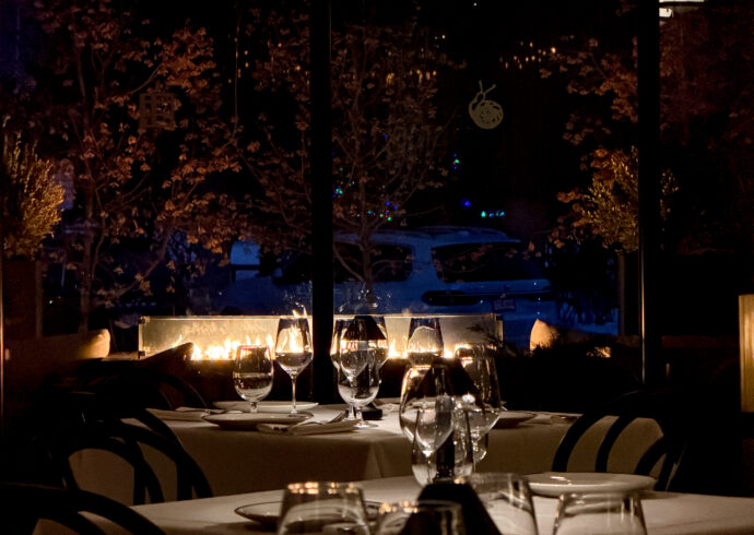 Petit Trois Aspen table settings at night