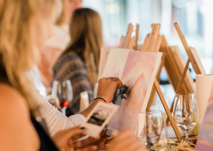 Students painting in a guided session with Kelly Peters