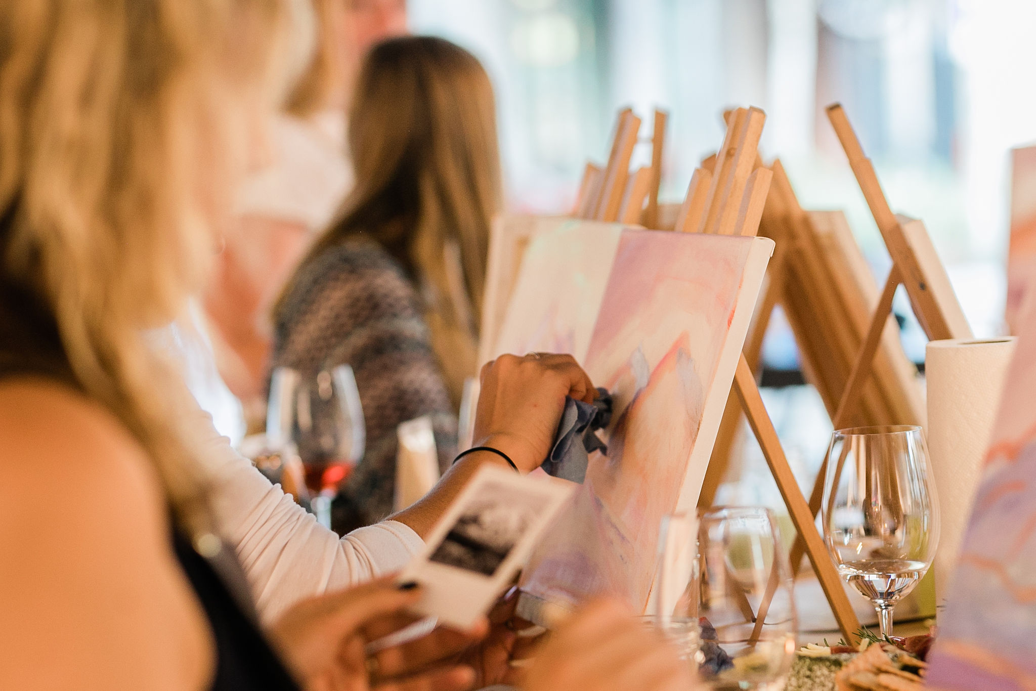 Students painting in a guided session with Kelly Peters
