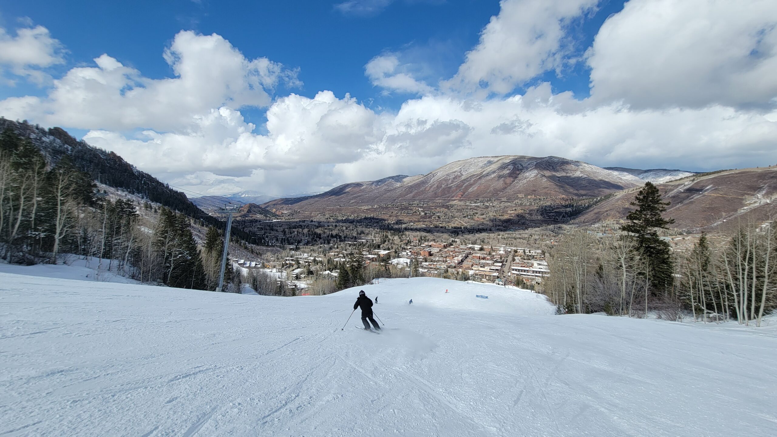 Skier skiing down Ajax Mountain