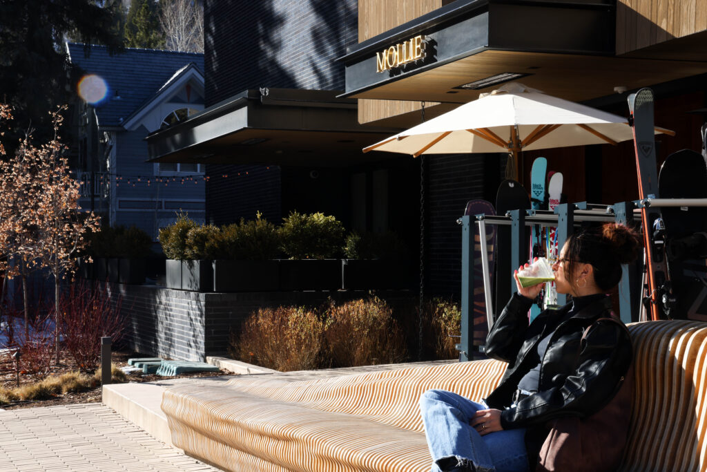 Guest enjoying a matcha from the Cafe outside of MOLLIE Aspen