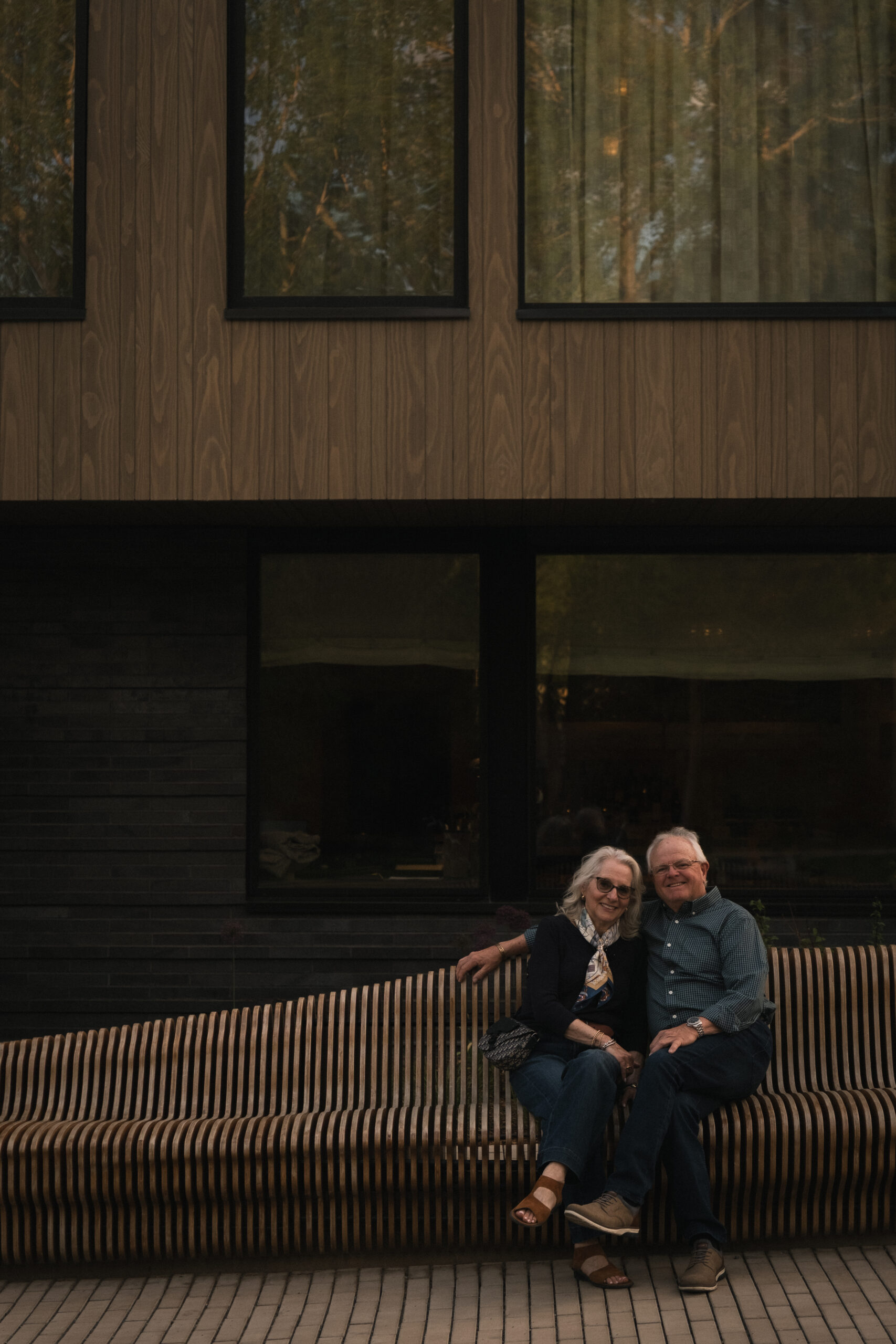 Guests sitting on the powder cloud bench located outside of MOLLIE Aspen