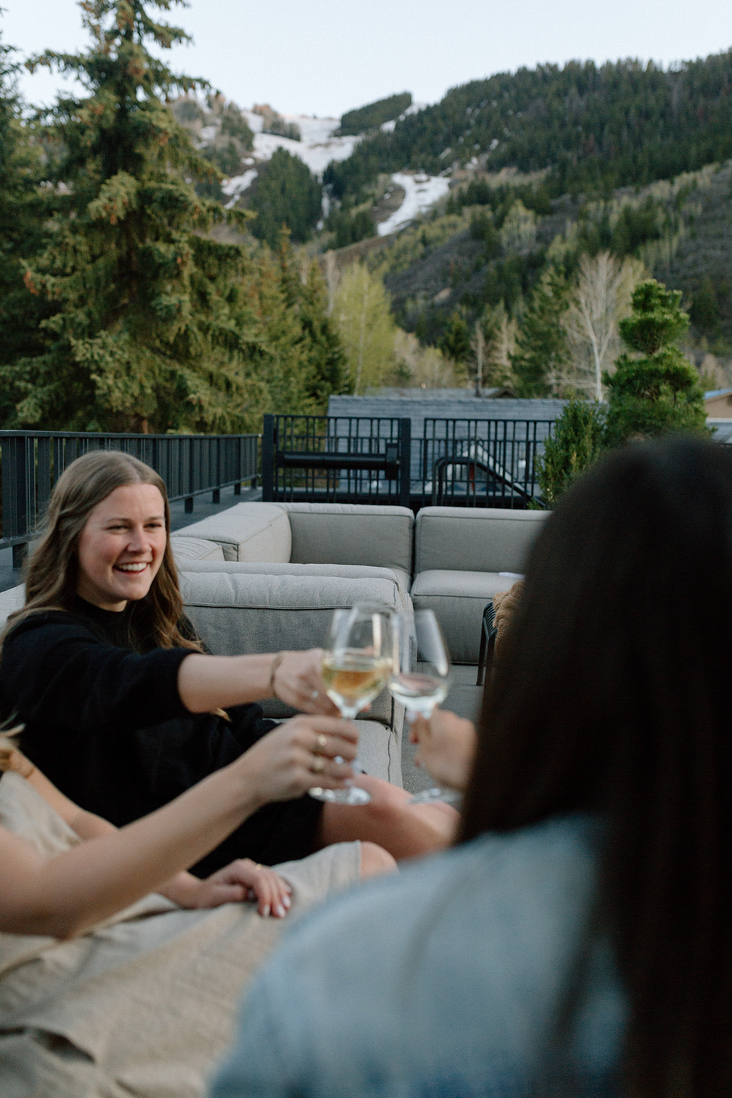Four females guests enjoying wine on Roof Terrace at MOLLIE Aspen in Spring