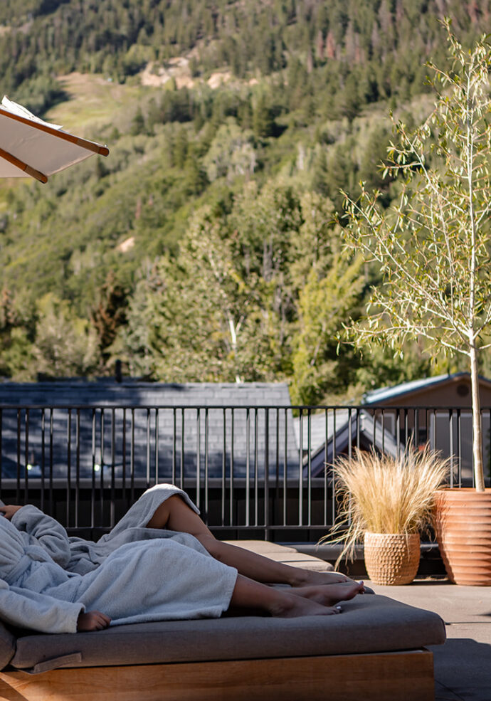 Two girls laying out on the Roof Terrace at MOLLIE Aspen
