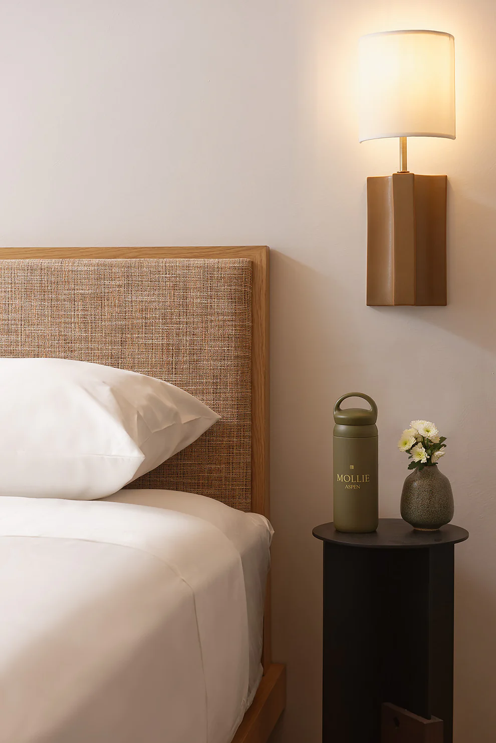 MOLLIE Water Bottle x Kinto, Olive on bedside table in MOLLIE guestroom