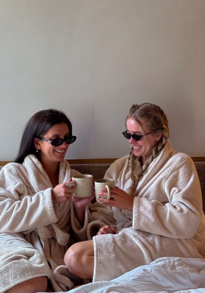 Sarah Smyth in bed with friend at MOLLIE Aspen