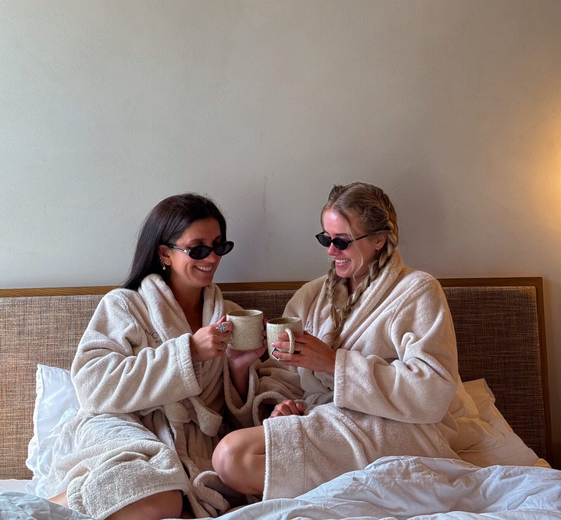 Sarah Smyth in bed with friend at MOLLIE Aspen