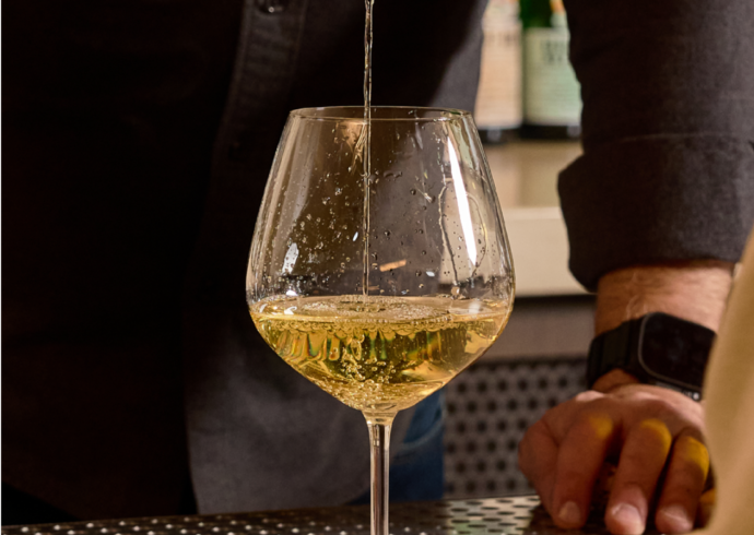 Wine being poured at Petit trois Aspen