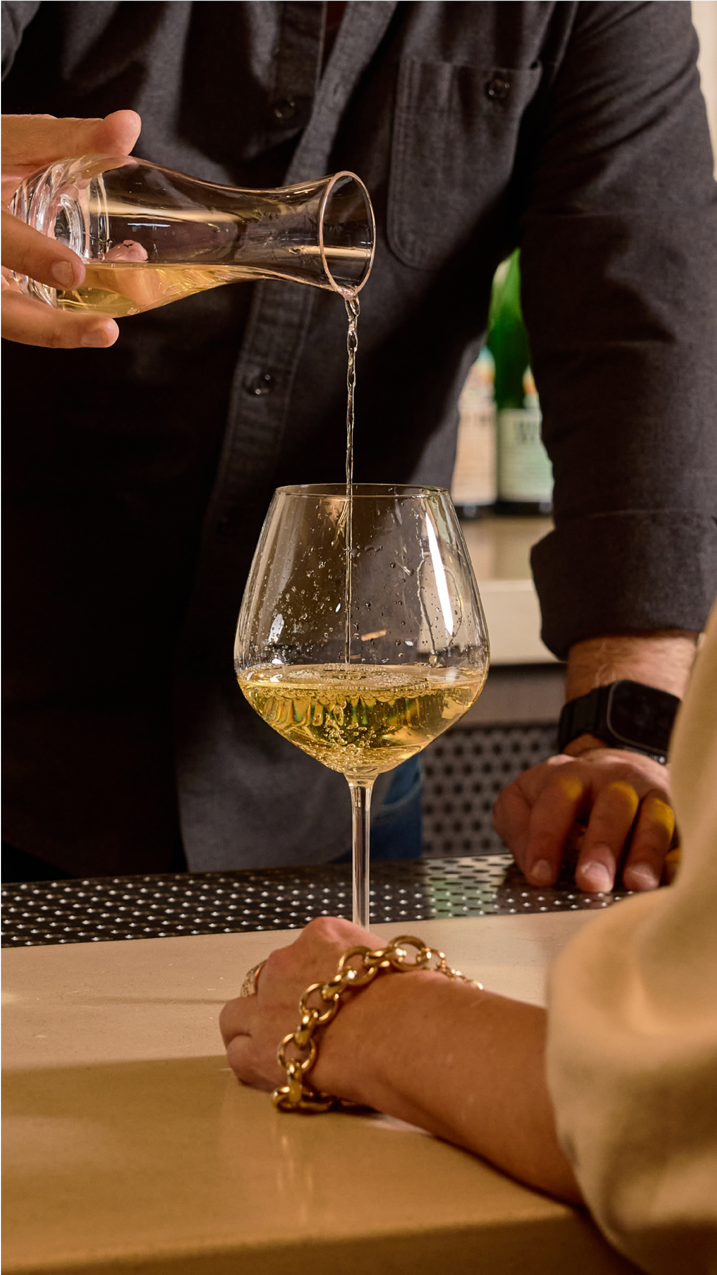 Wine being poured at Petit trois Aspen