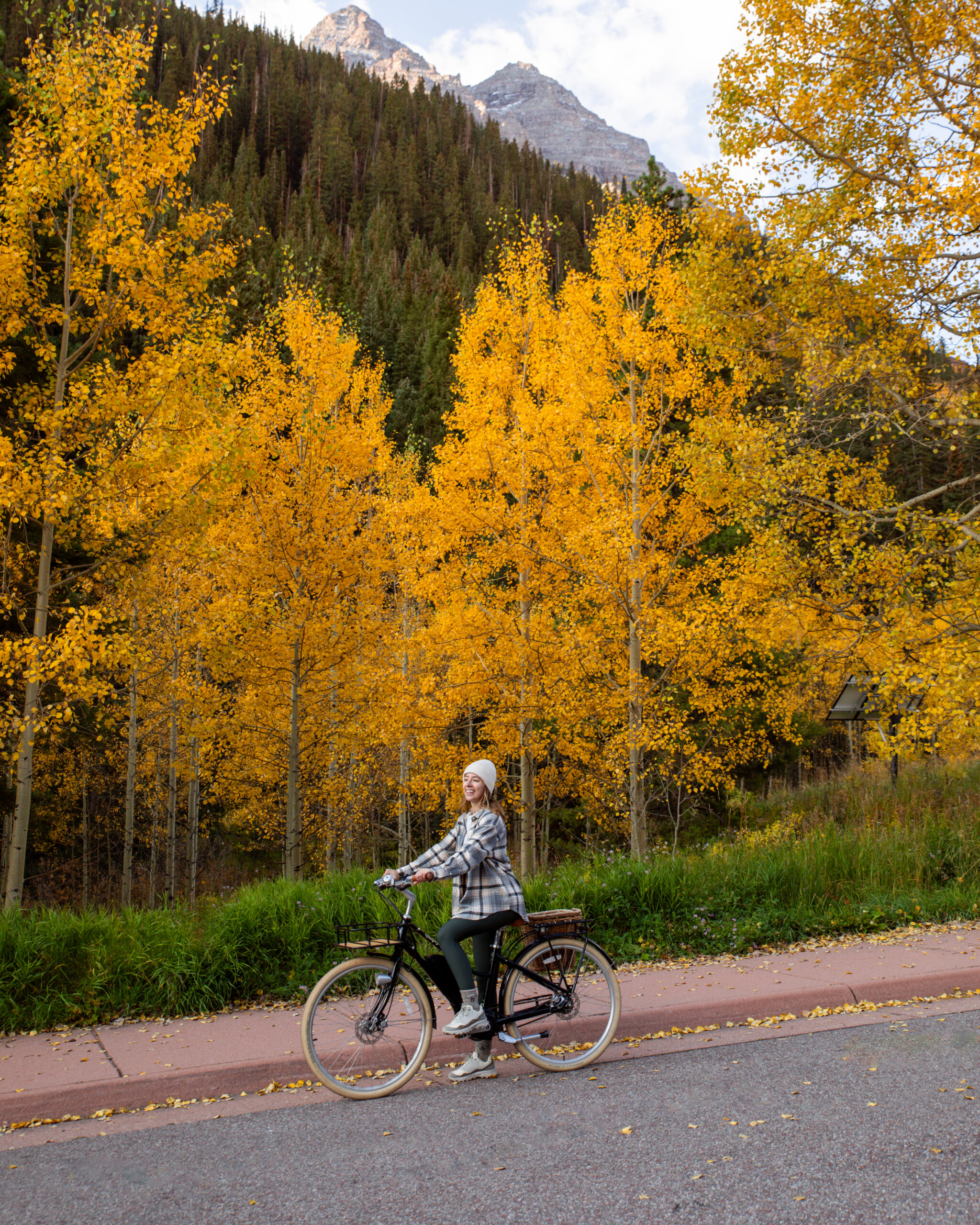 Female bike riding in Aspen during Fall