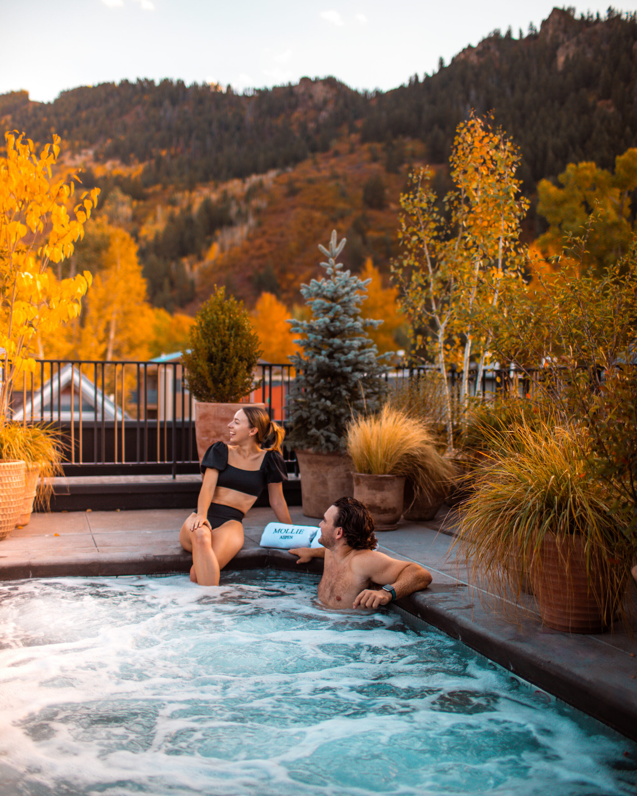 Guests in spa pool on the Roof Terrace at MOLLIE Aspen during Fall