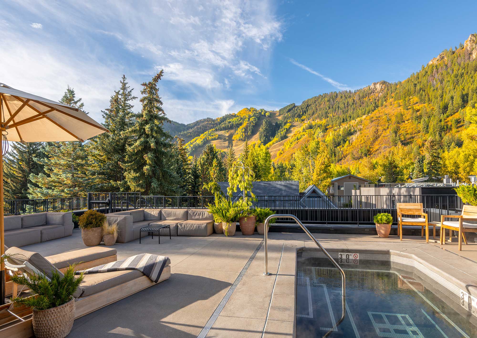 Fall colors on Aspen Mountain as viewed from the MOLLIE Roof Terrace with Spa Pool