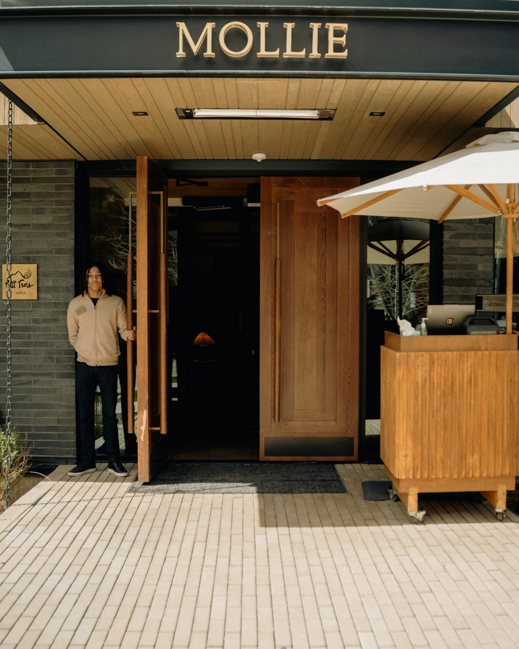 Bellman holding the door open at MOLLIE Aspen
